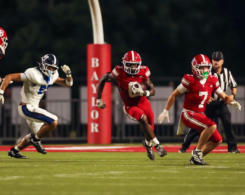 Baylor's David Gabriel Georges (0) finds running room against McCallie's defense for a big gain.