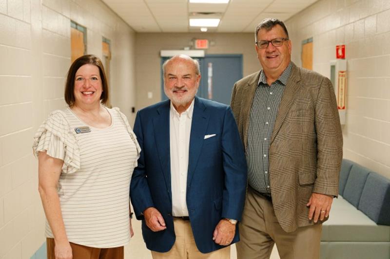 Mr. Jones (center) speaks with Dr. Sandra Godsey, dean of Career and Industry Programs (left) and Dr. John Squires, vice president of Academic Affairs (right) before his presentation.