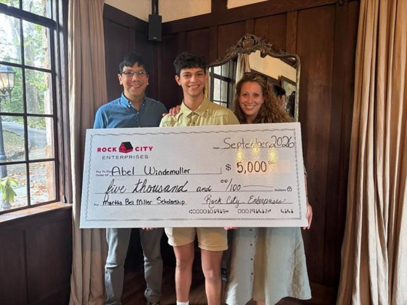 Abel Windemuller, center, pictured with his parents after receiving his scholarship from Rock City during a reception at Grandview