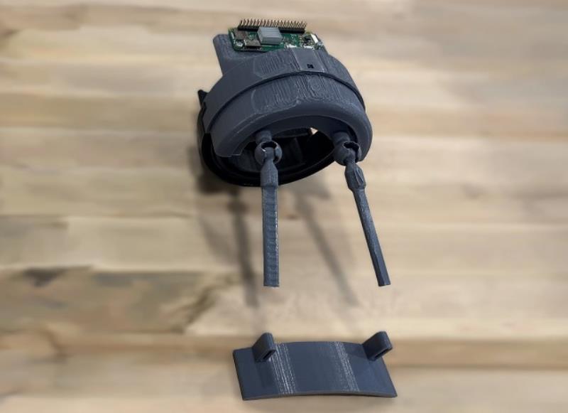 A 3D-printed prototype of the wearable essential tremor-control device incorporates sensors and adaptive control technology to help reduce shaking during voluntary movement.