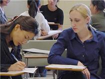 Sara Plowman, right, a TESOL student, helps Helen Lee, a voice major from Korea, with her studies.
