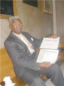 Rev. Leroy Fitch shows off his ministerial papers. He said another marrying preacher at the county courthouse is not legal. Click to enlarge all our photos. 