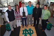 From left, Fred Eaves, ND Head strength and conditioning coach; Dianne Bruce; John-David Bruce; Tommy Bruce; Most Reverend Richard F. Stika, Bishop of Knoxville; and Josh Sellers, ND Head Football Coach.  Click to enlarge.