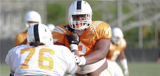 Freshman defensive lineman Shy Tuttle (2) goes against offensive lineman Chance Hall (76) during Tuesday's workouts at Haslam Field. Tennessee's Orange and White spring football is slated for Saturday at 4 p.m. at Neyland Stadium.























