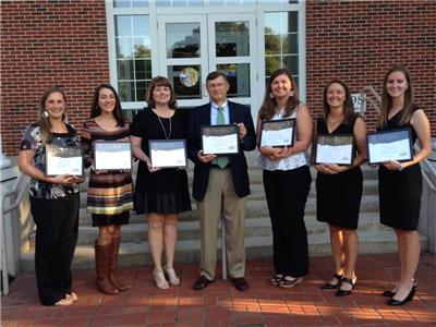 From left are this year’s Kappa Delta Pi honorees Sarah Sausville, Amber Montgomery, Betsy Gilbert, Ron Spangler, Stephanie Ortego, Andi Wendorf, and Emily Raper