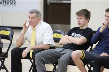 McMinn County wrestling coach David Stoika yells instructions to one of his wrestlers during a match earlier this season