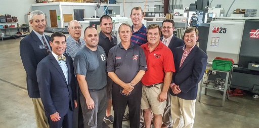 Visiting Densmore Machine in Whitfield County, Georgia to recognize the gift to Georgia Northwestern Technical College, were industry and local leaders from across Northwest Georgia. Shown in the front row, from left, are Rob Bradham, president and chief executive officer of the Greater Dalton Chamber of Commerce; Johnathon Densmore, chief operating officer of Densmore Machine; David Aycock, Jeffreys Manufacturing Solutions; John Densmore, Jr., chief executive officer of Densmore Machine, and Carl Campbell, vice president of Economic Development of the Greater Dalton Chamber of Commerce. In the back row, from left, are Chuck Payne, Georgia State Senator District 54; Carl Roberts, tooling supplier and engineer for Alternatives for Industry; Jimmy Densmore, chief financial officer and operations manager of Densmore Machine; Phil Shirley, Machine Tool Technology director at Georgia Northwestern Technical College, and Jason Gamel, director of Institutional Advancement at Georgia Northwestern Technical College.