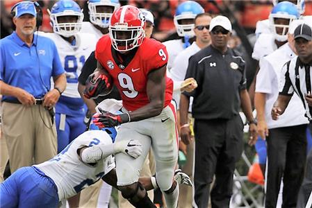 Jeremiah Holloman, Georgia wide receiver, carrying the ball at Sanford Stadium Saturday.