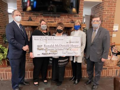  Members of the Chattanooga Chapter of the Americans Inns of Court — IOC Treasurer Adam Izell, attorney with Duncan, Hatcher, Holland & Fleenor, P.C.; Kara West, Chapter 12/13 Trustee; IOC President Chancellor Pamela Fleenor; and IOC Secretary Magistrate Ron Powers — present a donation check to Jane Kaylor (center), CEO of the Ronald McDonald Charities of Greater Chattanooga. Ms. West also serves as the Board Chair at the Ronald McDonald House. 