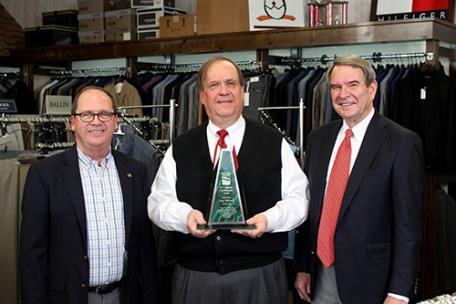From left, Mike Griffin, president and CEO of Cleveland/Bradley Chamber of Commerce; Larry McDaniel, owner of The Town Squire and 2021 recipient of the M.C. Headrick Award; and Lee Stewart, regional president of Southern Heritage Bank