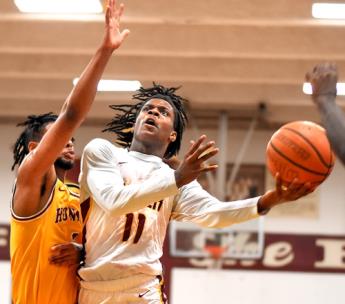 Tyner's Keilan Holloway drives to the goal against Howard's Mark Greer.