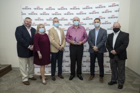 Pictured, left to right: Cameron Taylor, senior manager, fleet operations; Darlene Wright, HR manager; Jamie Miller, manager, fleet operations; Luther “Junior" Weaver, OTR driver; Brian Walraven, senior director, transportation; and Mitch Chastain, director, safety