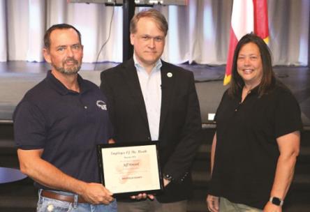 Whitfield County March Employee of the Month Jeff Howard (left) of Whitfield Transit is congratulated by Commission Chairman Jevin Jensen and Transit Director Diane Franklin during Monday’s county commission meeting