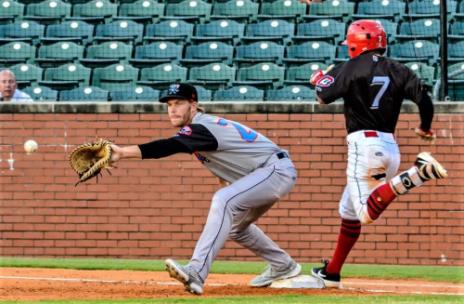 The Lookouts' Lorenzo Cedrola (7) beats out a throw to Rocket City first baseman David McKinnon in Chattanooga's 11-0 win over the Trash Pandas Wednesday night at AT&T Field. The teams play again Thursday night with first pitch at 7:15 p.m.