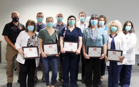 The Chattanooga Fire Department recognized seven hospital colleagues for their outstanding efforts in protecting the safety and welfare of patients during and following a small fire June 10