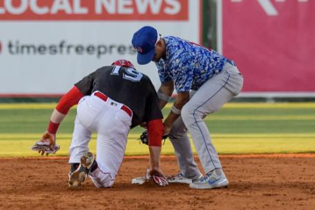 The Lookouts' Jay Schuyler (19) beats the Smokies' Chris Morel back to the bag to foil a pick-off attempt. Chattanooga lost, 5-2. 