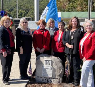 From left, Marti Rutherford, treasurer; Nancy Anderson, librarian; Cindy Dearing, first vice regent; Trish Mullins, second vice regent; Norma Hansen, chaplain; Gayle Burrows, chapter regent; and Karen Durbin, corresponding secretary