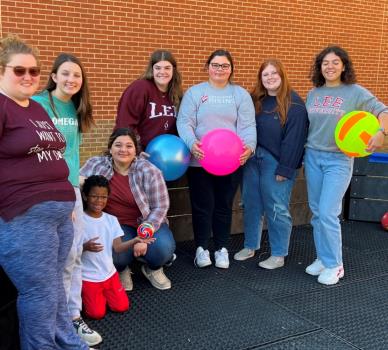 Lee students with one of the children who attended the Fall Field Day at the Ray Conn Sports Complex