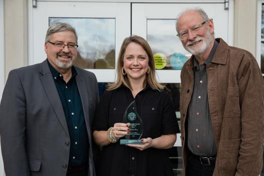 Dr. Jennifer Fease with Dr. Randy Wood, left, and Dr. Robert Barnett, right, after receiving the department’s Alumna of the Year Award