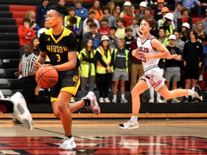 Hixson's Kaden Herman brings the ball up on a fast break.