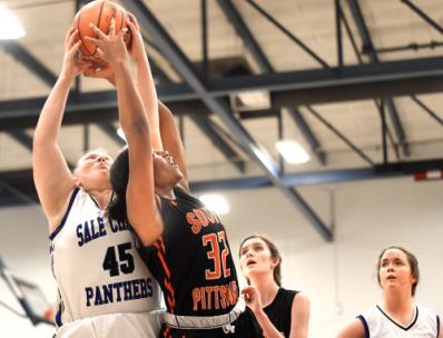 Sale Creek's Shelby Defore and South Pittsburg's Te'Aiysha Baker fight for a rebound.