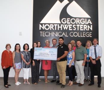 Pictured, from left: Phyllis Stephens, Greater Dalton Chamber of Commerce; Kapua Keefe, Dalton Public Schools; Tracie Simmons, Whitfield County Schools; Rachel Ogle, Hamilton Medical Center; Alisa Basaraba, North Georgia Electric Membership Corp.; Terri Woodruff, Anna Shaw Children’s Institute; Andrew Barkley, Shaw Industries; Salvador Arreguin, director and instructor of the Diesel Equipment Technology program at GNTC; Abbi Smith, Fabric Sources International; Dr. Elizabeth Anderson, vice president of Academic Affairs at GNTC; Chris Parker, Whitfield County Schools; Dr. Heidi Popham, president of GTNC; and Josh Weeks, Conasauga Judicial Circuit pose for the presentation of a $2,460 check to GNTC to purchase basic tool kits for 12 Diesel Equipment Technology students.