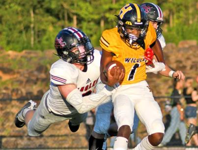 Signal Mountain's Rip Hutcherson leaps to grab Hixson's Michael Kendricks