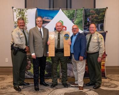 Radnor Lake State Park is named Tennessee State Park of the Year to go with its award for best state park in sustainability. From left are Chris Padgett, area manager; Greer Tidwell, deputy commissioner of TDEC; Steve Ward, park manager; David Salyers, commissioner of TDEC; and Mike Robertson, director of operations for Tennessee State Parks.