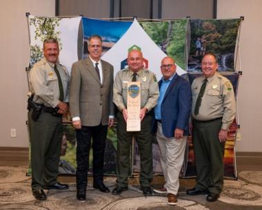 Radnor Lake State Park is named Tennessee State Park of the Year. From left are Chris Padgett, area manager; Greer Tidwell, deputy commissioner of TDEC; Steve Ward, park manager; David Salyers, commissioner of TDEC, and Mike Robertson, director of operations for Tennessee State Parks.