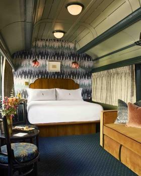 Restored train carriage sleeper deluxe room at The Hotel Chalet at The Choo Choo
