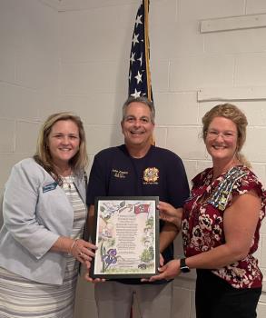Judge David Campbell Chapter, NSDAR members, Samantha Green and Meegan Burton present the framed TN State Poem poster to VFW representative, John Zapata