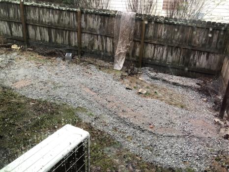 Gravel deposit in yard below the sinkhole