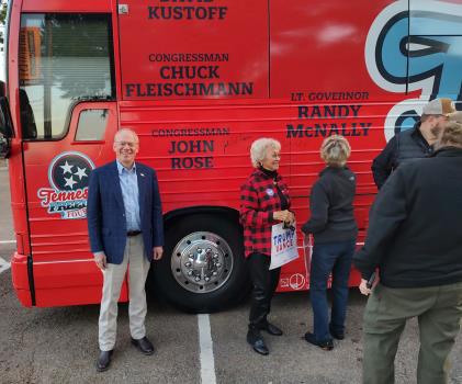 Congressman Rose signs his name to the side of the bus. People who came out were urged to sign the bus