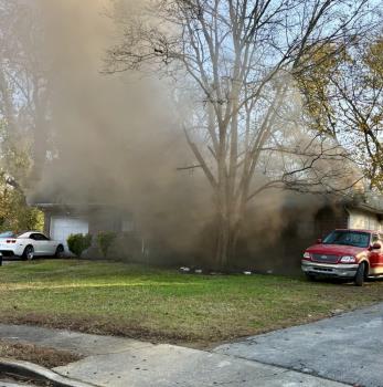 Firefighters Knock Down Fire Next To House On Sheridan Court