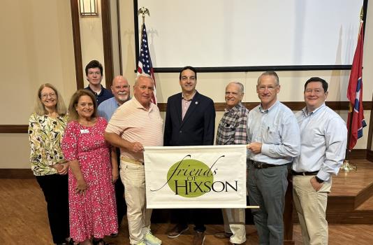 Pictured, left to right: Brenda Edwards, COO for Scenic Community Credit Union; Rosemary Dworak, Friends of Hixson secretary; Nick Devens, field rep. for Marsha Blackburn; Gary Behler, HCO Juvenile Court clerk; Greg Taylor, Friends of Hixson president; Greg Martin, TN state rep., District 26 (speaker); Larry Zehnder, Friends of Hixson board member; Bo Watson, TN state senator; and David Queen, owner of Queen Financial Services Corp.