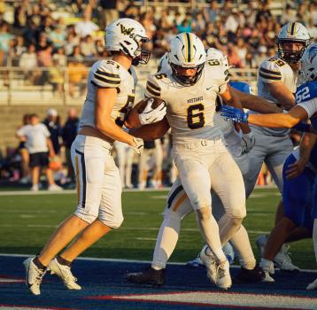 Walker Valley's Cason Cunningham (6) scores in the Mustangs 28-3 win over Cleveland.