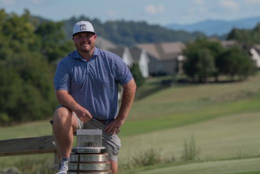 Ryan Botts displays the champion's trophy for winning the Tennessee PGA Professional Championship