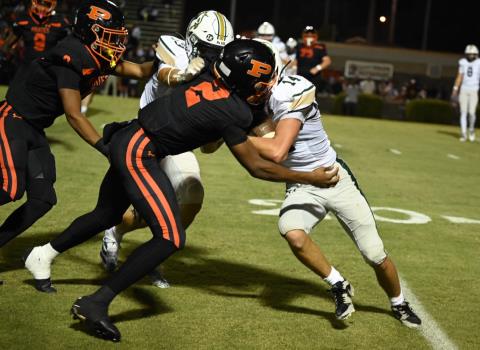 Silverdale’s Cannon Rogers (14) is tackled by South Pittsburgh’s Dayon Cooper (2) after an impressive catch thrown by quarterback Connor Jenne (8). It was a 40-yard Jenne to Rogers TD that pushed the Seahawks to a 10-0 win over the Pirates.