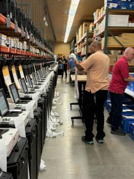 Republican and Democrat election officials test the voting equipment